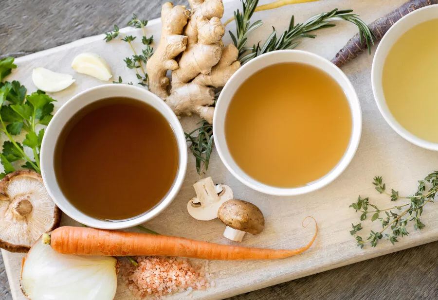 Bowls of beef bone broth and beef bone extract